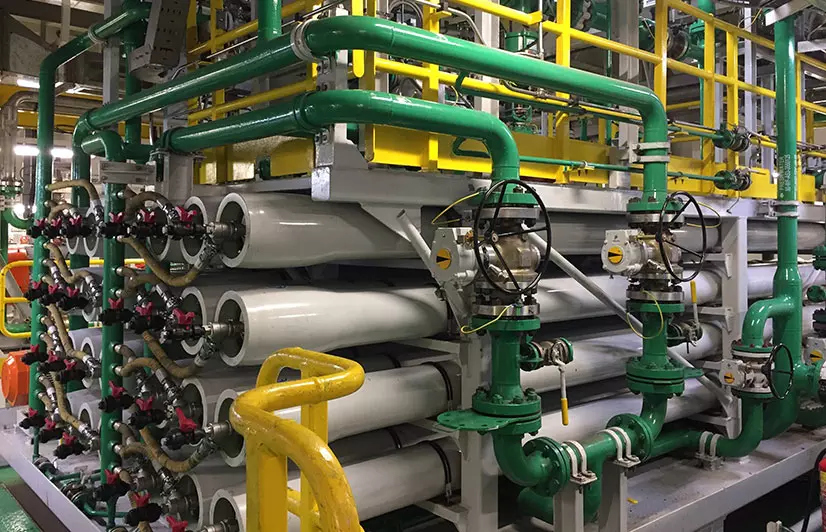 Industrial RO membrane bank with pressure gauges and valves used for system monitoring